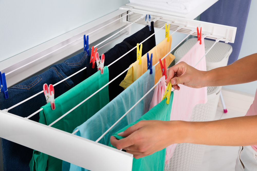 Close up,Of,Woman,Hanging,Wet,Clean,Cloth,On,Clothes,Line